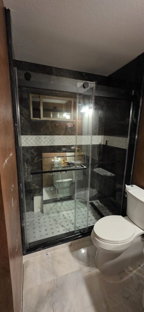 Black-frame glass shower – Fixora Remodeling, Plano TX