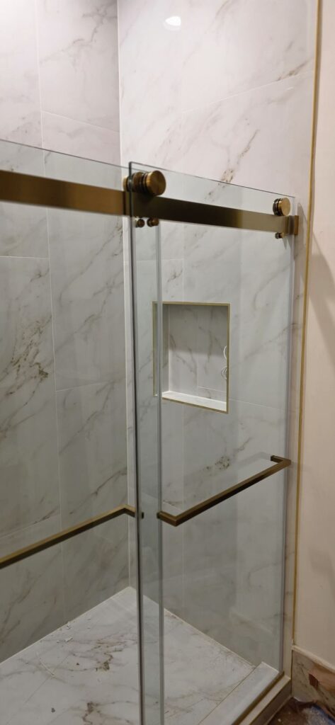 Gold-trim shower door – Fixora Remodeling, Plano TX