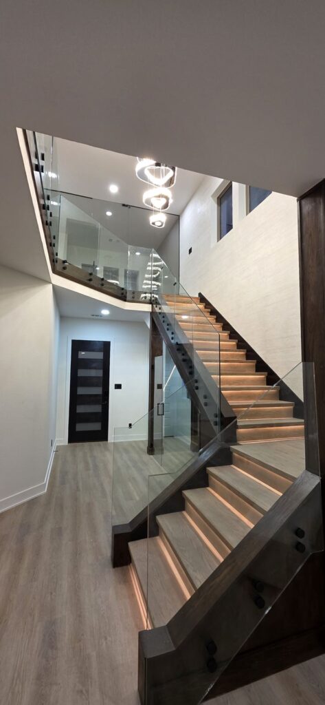 Floating stairs & glass railing by Fixora in Plano, TX