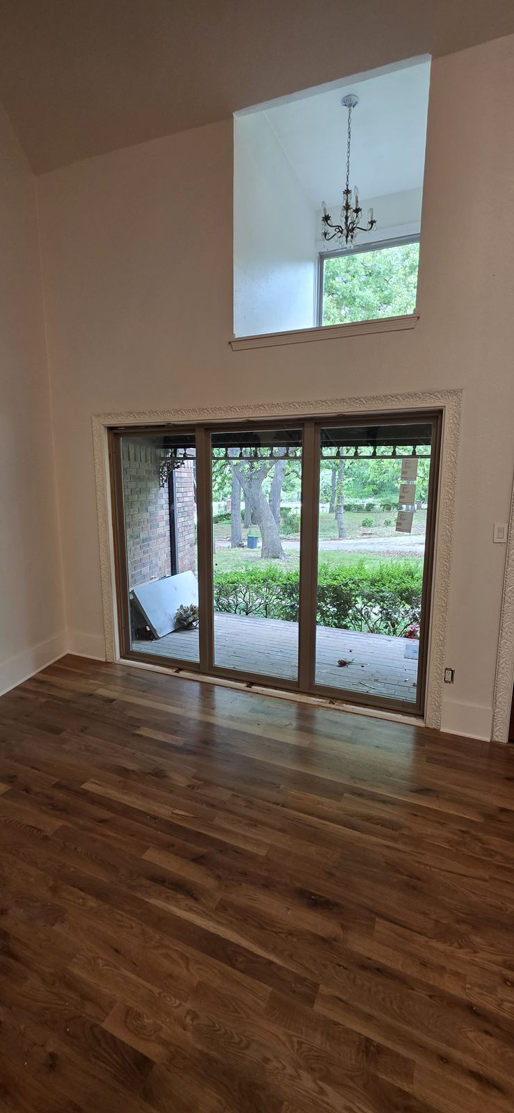 Large sliding glass doors bring in natural light and connect the home to the backyard.